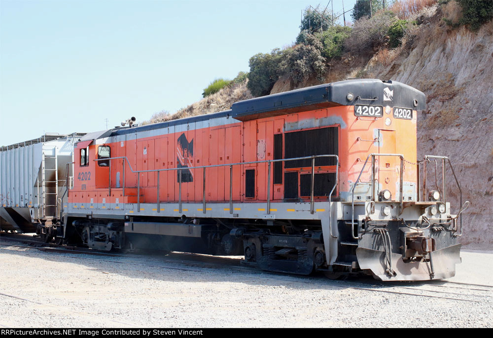 Baja Califorqia RR crew with ex Conrail B23-7 ATFX 4202 pushes the day's US bound cars into the SD&IV yard in San Ysidro.